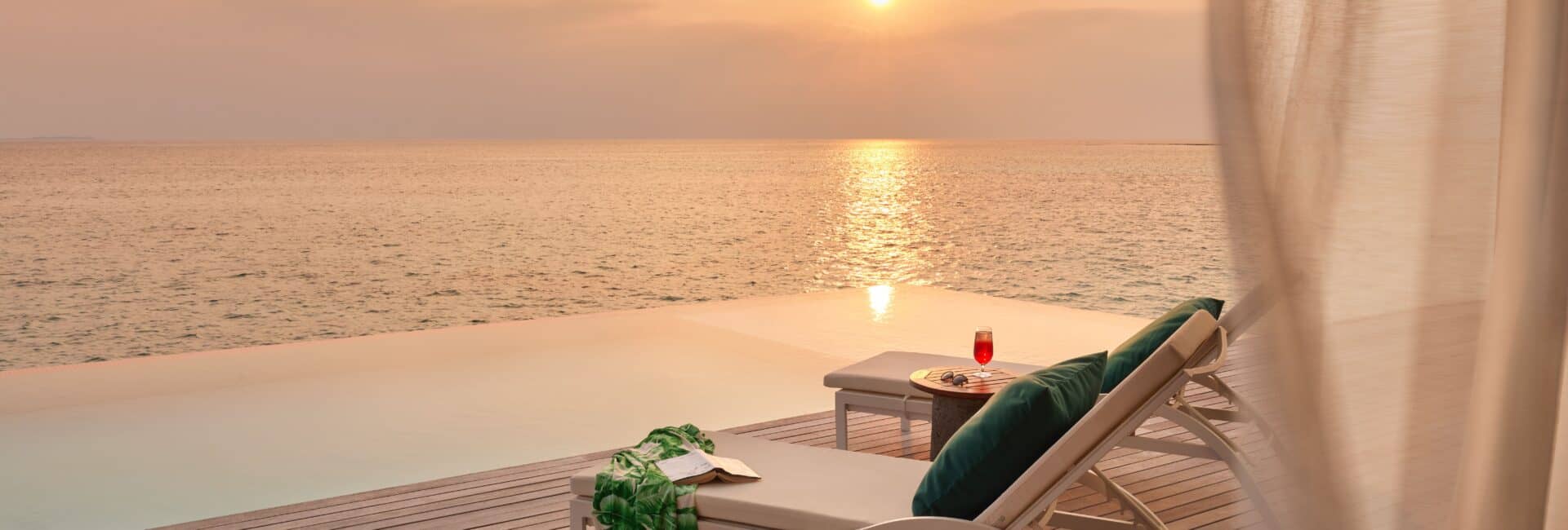 Jumeirah Maldives_High_resolution_300dpi-Jumeirah Maldives - Pool Deck sunset view